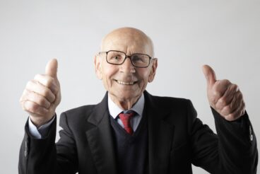 positive-senior-man-in-eyeglasses-showing-thumbs-up-and-3824771 (2500px)